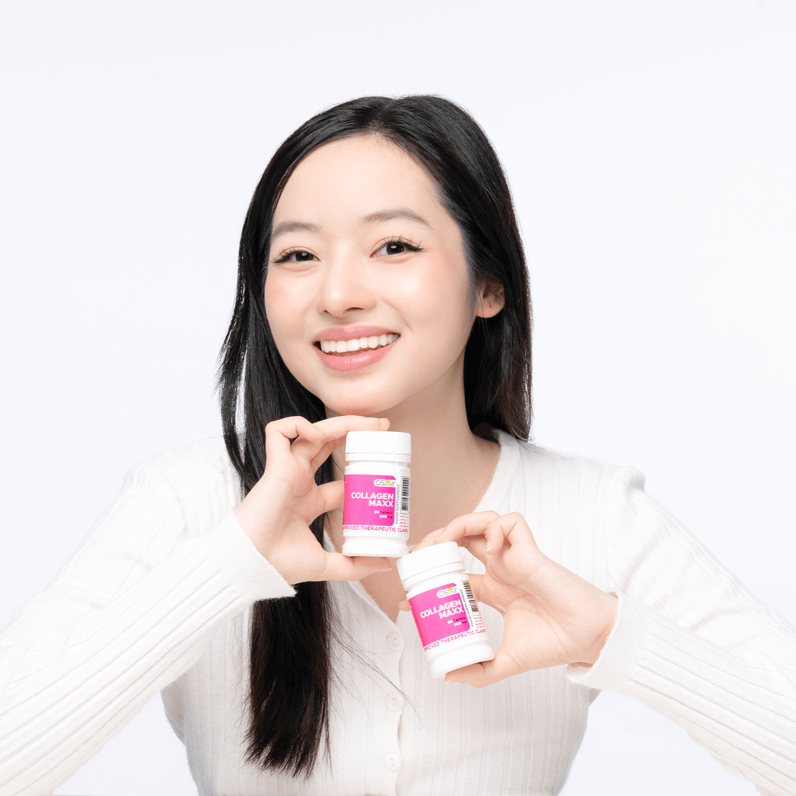 Happy woman holding OSwell Collagen Maxx supplements for healthy skin