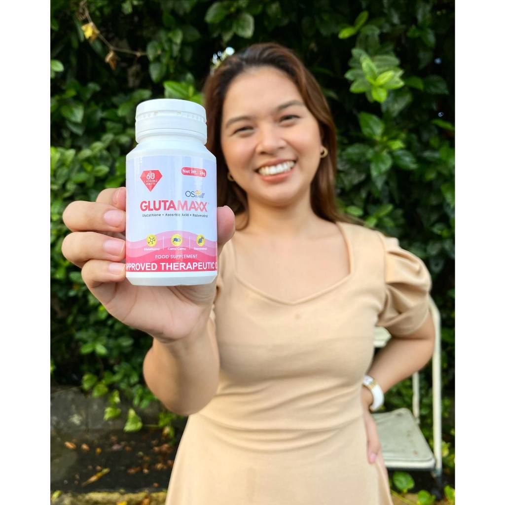 Model with radiant skin holding Gluta Maxx bottle